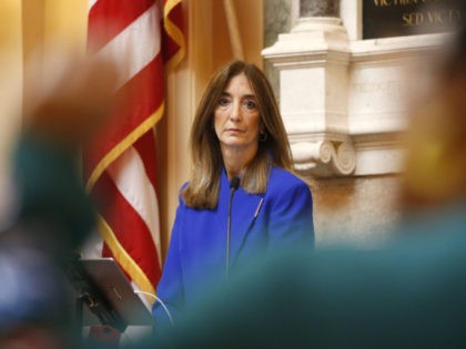 House speaker Del. Eileen Filler-Corn, D-Fairfax, listens to Del. Marcia 'Cia' Price, D-Newport News, foreground during the House session at the Capitol Thursday, March. 5, 2020, in Richmond, Va. (AP Photo/Steve Helber)