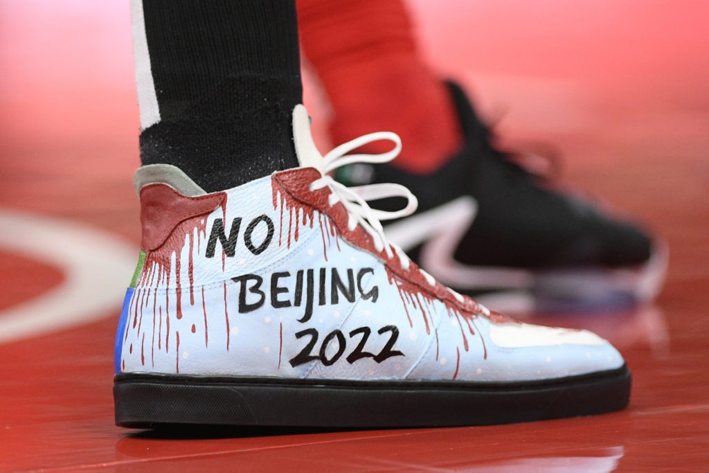 The shoes of Boston Celtics center Enes Kanter as seen during the first half of an NBA basketball game against the Washington Wizards, Saturday, Oct. 30, 2021, in Washington. (AP Photo/Nick Wass)