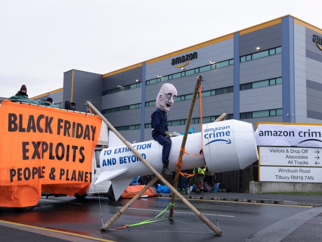 TILBURY, ENGLAND - NOVEMBER 26: Extinction Rebellion protesters block an Amazon fulfillment centre on November 26, 2021 in Tilbury, England. Extinction Rebellion have blockaded Amazon Fulfillment centres around the UK On Black Friday. (Photo by Dan Kitwood/Getty Images)
