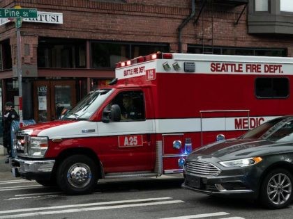 An ambulance leaves the Capitol Hill Organized Protest (CHOP) area as police block the road on July 1, 2020 in Seattle, Washington. (David Ryder/Getty Images)