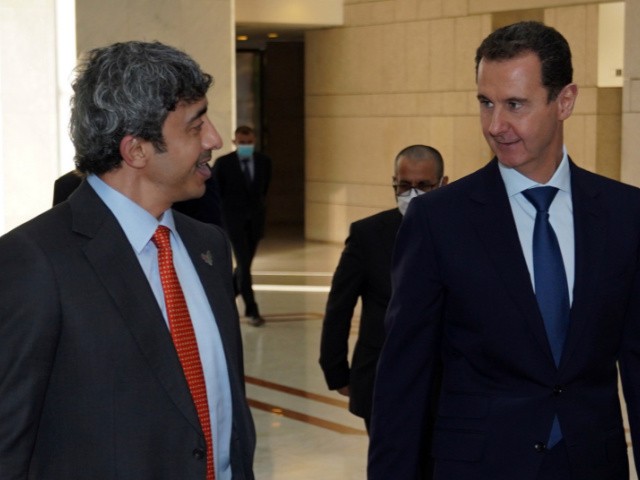 In this photo released by the Syrian official news agency SANA, shows Syrian President Bashar Assad, right, speaks with Sheikh Abdullah bin Zayed Al Nahyan, the Foreign Minister of the United Arab Emirates, in Damascus, Syria, Tuesday, Nov. 9, 2021. Al Nahyan's visit to Syria is the first time since the Syrian conflict began a decade ago and comes as some Arab countries are improving relations with Syria. The UAE has been slowly mending ties with Damascus, as the tide of the war has turned in favor of President Bashar Assad. (SANA via AP)