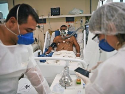 A coronavirus patient is treated at the Oceanico hospital in Niteroi, Rio de Janeiro on Ju