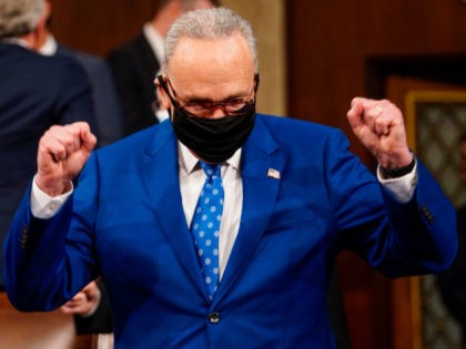 Senate Majority Chuck Schumer celebrates before US President Joe Biden addresses a joint session of Congress on at the US Capitol in Washington, DC, on on April 28, 2021. (Photo by Melina Mara / POOL / AFP) (Photo by MELINA MARA/POOL/AFP via Getty Images)