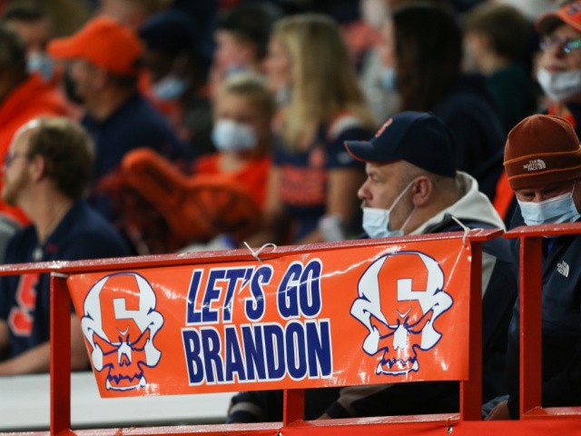A sign reading "Let's go Brandon" is displayed on the railing in the first half of an NCAA college football game between Boston College and Syracuse in Syracuse, N.Y., Saturday, Oct. 30, 2021. Critics of President Joe Biden have come up with the cryptic new phrase to insult the Democratic president. (AP Photo/Joshua Bessex)