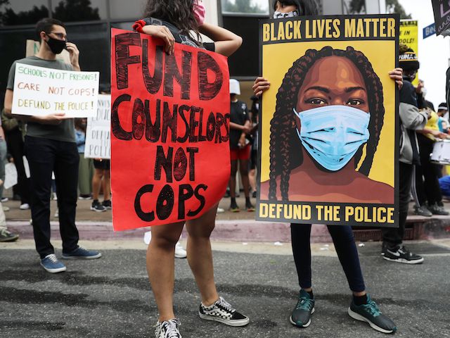 Black Lives Matter-Los Angeles supporters protest outside the Unified School District headquarters calling on the board of education to defund school police on June 23, 2020 in Los Angeles, California. (Mario Tama/Getty Images)