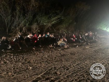 Eagle Pass Station agents apprehend a large group of migrants who illegally crossed the Rio Grande at night. (U.S. Border Patrol/Del Rio Sector)