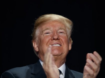 President Donald Trump smiles during the National Prayer Breakfast, Thursday, Feb. 8, 2018, in Washington.
