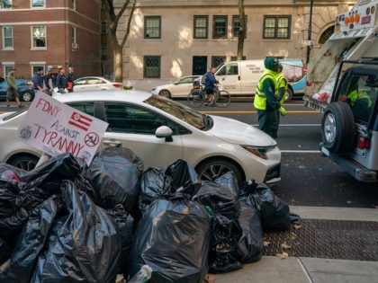 Trash sits uncollected on the side walk near a protest against the Covid-19 vaccine mandate intended for municipal workers at Gracie Mansion on October 28, 2021 in New York City. (David Dee Delgado/Getty Images)