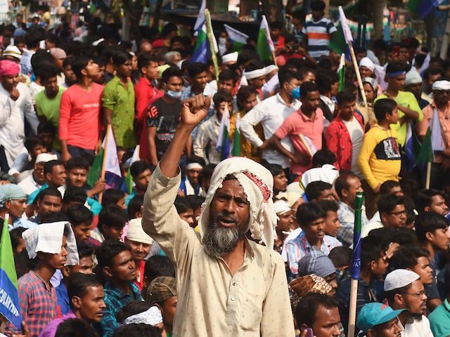 Activists of the newly formed Indian Secular Front (ISF) party participate in a rally to protest against the new farm laws and the recent fuel price hike, in Kolkata on February 23, 2021. (Dibyangshu Sarkar/AFP via Getty Images)