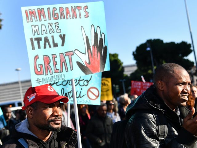 People, including employees of the country's social and reception centers and members of anti-racism associations, march against the government's social politics, its recent decree restricting the right to asylum, and against racism on November 10, 2018 in downtown Rome. (Photo by Alberto PIZZOLI / AFP) (Photo credit should read ALBERTO …