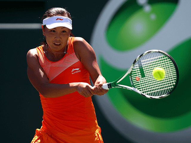 Shuai Peng of China hits a backhand return against Svetlana Kuznetsova of Russia during the Sony Ericsson Open at Crandon Park Tennis Center on March 26, 2011 in Key Biscayne, Florida. (Photo by Clive Brunskill/Getty Images)