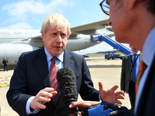 BIARRITZ, FRANCE - AUGUST 24: British Prime Minister Boris Johnson disembarks a plane as h