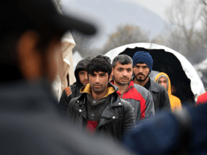 Illegal migrants line-up for lunch distribution, on November 20, 2019, at "Vucjak" camp, i