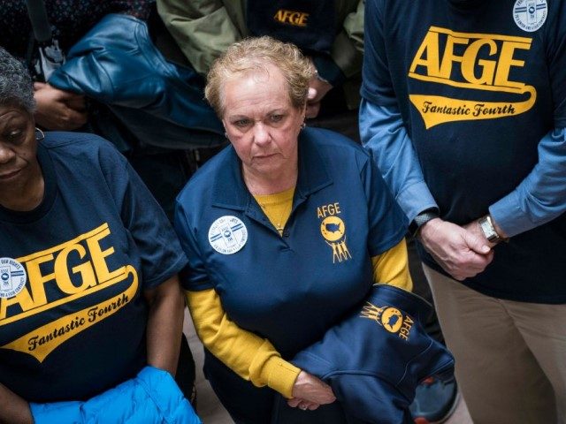 Members and supporters of the American Federation of Government Employees (AFGE) participate in a "Stand Up, Stand In protest in the Hart Senate Office Building Atrium as part of the 2020 Legislative and Grassroots Mobilization Conference on February 11, 2020 in Washington, DC. AFGE members say they protested to raise …