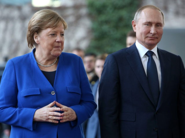BERLIN, GERMANY - JANUARY 19: German Chancellor Angela Merkel (CDU, L) greets Russian President Vladimir Putin as he arrives for an international summit on securing peace in Libya at the German federal Chancellery on January 19, 2020 in Berlin, Germany. Leaders of nations and organizations linked to the current conflict …
