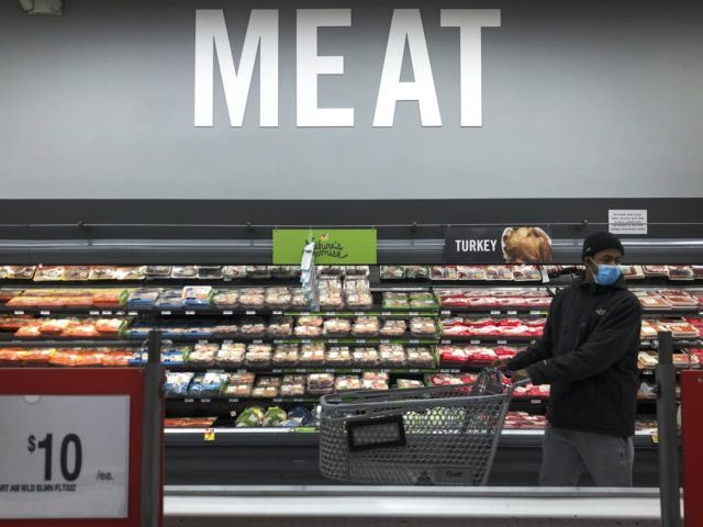 WASHINGTON, DC - APRIL 28: A man shops in the meat section at a grocery store, April 28, 2020 Washington, DC. Meat industry experts say that beef, chicken and pork could become scarce in the United States because many meat processing plants have been temporarily closed down due to the …