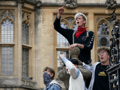 OXFORD, ENGLAND - JUNE 09: Demonstrators gather outside University of Oxford's Oriel College during a protest called by the Rhodes Must Fall campaign on June 09, 2020 in Oxford, England. The Rhodes Must Fall campaign protests outside University of Oxford's Oriel College where a statue of imperialist Cecil John Rhodes …