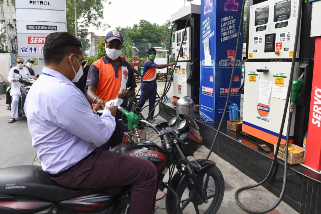 A fuel pump attendant fills a motorbike with petrol at a gas station, as fuel prices continue to rise, in Amritsar on June 26, 2020. (Photo by NARINDER NANU / AFP) (Photo by NARINDER NANU/AFP via Getty Images)