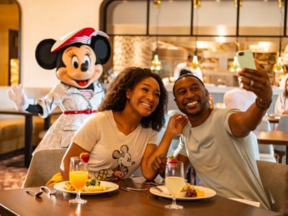 In this handout photo provided by Walt Disney World Resort, guests at Disney's Riviera Resort see Mickey Mouse, Minnie Mouse, Donald Duck and Daisy Duck during breakfast at Topolino's Terrace Flavors of the Riviera, the resorts rooftop restaurant on June 23, 2020 in Lake Buena Vista, Florida. During the phased …