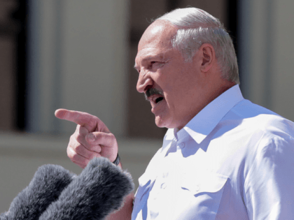 Belarus' President Alexander Lukashenko delivers a speech during a rally held to support him in central Minsk, on August 16, 2020. - The Belarusian strongman, who has ruled his ex-Soviet country with an iron grip since 1994, is under increasing pressure from the streets and abroad over his claim to …