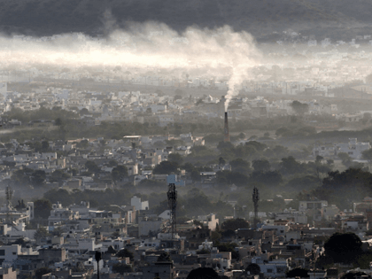 Smoke billows from a factory chimney during smoggy morning in Ajmer on November 2, 2020. (Photo by Himanshu SHARMA / AFP) (Photo by HIMANSHU SHARMA/AFP via Getty Images)
