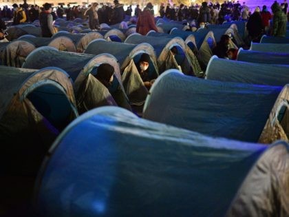 TOPSHOT - Migrants and associations install tents on Republique square in Paris on November 23, 2020, one week after migrants were evacuated from a makeshift camp in the northern Paris popular suburb of Saint-Denis without being relocated. (Photo by MARTIN BUREAU / AFP) (Photo by MARTIN BUREAU/AFP via Getty Images)