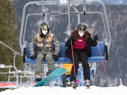 Skiers with protective face masks leave a chairlift of the ski lift in the Semmering ski area, Lower Austria on December 24, 2020. - Austria allowed its more than 400 ski stations to open, just two days before the country enters its third nationwide coronavirus lockdown. (Photo by ALEX HALADA …