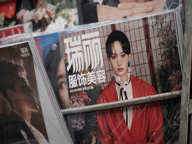 The cover of a fashion magazine shows Chinese actress Zheng Shuang at a newsstand in Beiji
