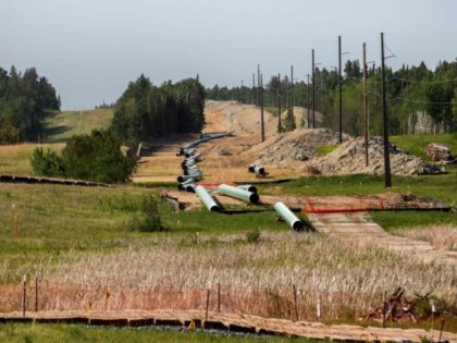 Sections of the Enbridge Line 3 pipeline are seen on the construction site in Park Rapids, Minnesota on June 6, 2021. - Line 3 is an oil sands pipeline which runs from Hardisty, Alberta, Canada to Superior, Wisconsin in the United States. In 2014, a new route for the Line …