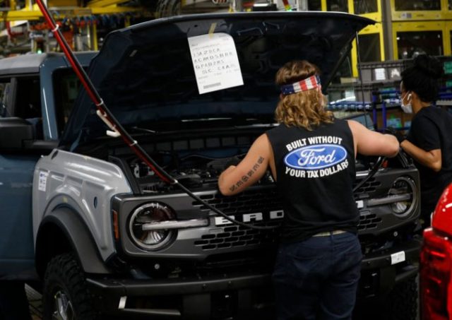 Line workers assemble Ford Motor Company's 2021 Ford Bronco on the line at their Mich