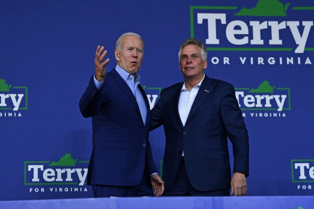 US President Joe Biden (L) greets Virginia gubernatorial candidate Terry McAuliffe during