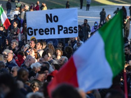 People gather during a protest against the so-called Green Pass on October 15, 2021 at Circo Massimo in Rome, as new coronavirus restrictions for workers come into effect. - Italy braced for nationwide protests, blockades and potential disruption on October 15, 2021 as all workers must show a so-called Green …