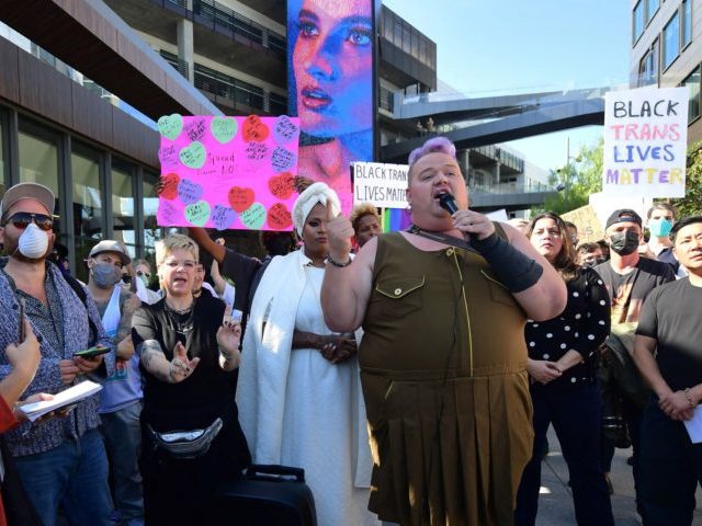 People rally in support of the Netflix transgender walkout in Los Angeles, California on O