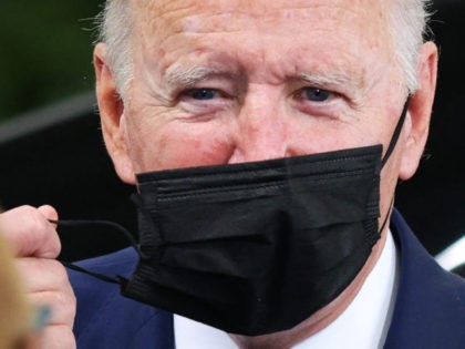 US President Joe Biden removes his face covering as he arrives for the COP26 UN Climate Summit in Glasgow on November 1, 2021. - More than 120 world leaders meet in Glasgow in a "last, best hope" to tackle the climate crisis and avert a looming global disaster. (Photo by …