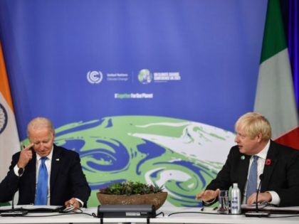 US President Joe Biden (L) reacts as he listens to British Prime Minister Boris Johnson (R) during a meeting on "the Build Back Better World (B3W)", as part of the World Leaders' Summit of the COP26 UN Climate Change Conference in Glasgow, Scotland, on November 2, 2021. - World leaders …