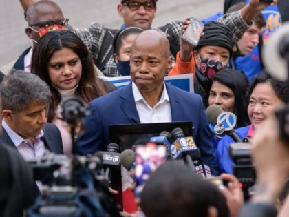 New York democratic mayoral candidate Eric Adams (C) speaks to supporters and the media upon leaving a voting center after casting his ballot, in Brooklyn, New York on November 2, 2021. - New Yorkers head to the polls in a mayoral election that is virtually guaranteed to elect Black former …