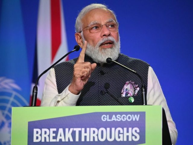 India's Prime Minister Narendra Modi speaks at the World Leaders' Summit "Accelerating Clean Technology Innovation and Deployment" session at the COP26 Climate Conference at the Scottish Event Campus in Glasgow, Scotland on November 2, 2021. - More than 80 countries have signed up to a US and EU pledge to …