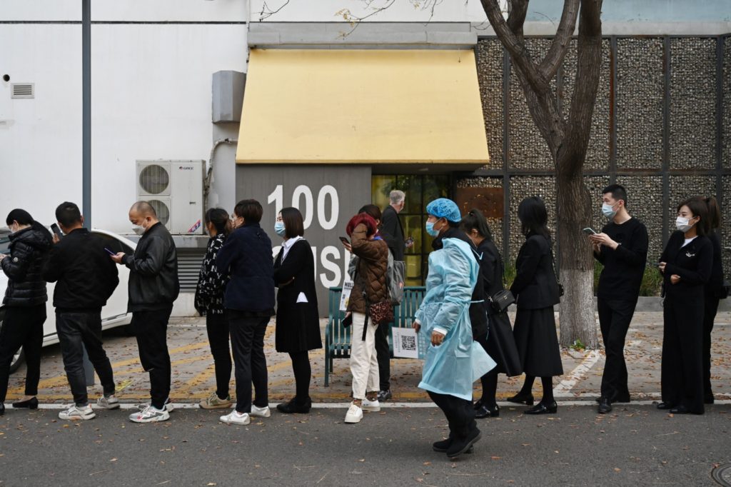 People line up to get Covid-19 coronavirus tests in Beijing on November 4, 2021. (Photo by GREG BAKER / AFP) (Photo by GREG BAKER/AFP via Getty Images)