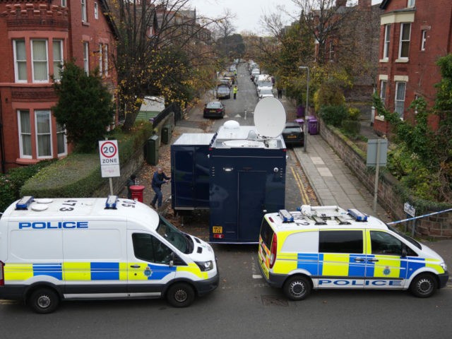 LIVERPOOL, ENGLAND - NOVEMBER 15: Police cars block the road as a control centre is set up in Rutland Avenue after properties were raided by armed officers yesterday on November 15, 2021 in Liverpool, England. A man was killed when the taxi in which he was riding exploded outside Liverpool …