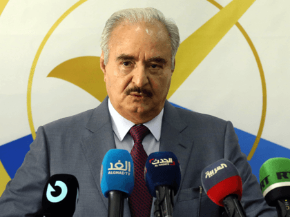 Libya's eastern military chief Khalifa Haftar gives a speech at the local headquarters of the High National Election Commission in the eastern city of Benghazi on November 16, 2021. - Haftar registered on November 16 to run for president in a December 24 election also contested by a son of …