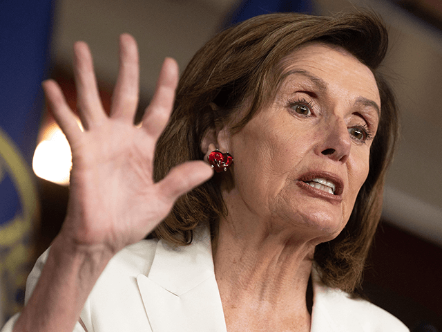 Speaker of the House Nancy Pelosi (C), D-CA, speaks during a news conference with Democratic leaders after the passage of the Build Back Better Act at the US Capitol in Washington, DC, on November 19, 2021. - US lawmakers voted to elevate President Joe Biden's giant social welfare bill to …