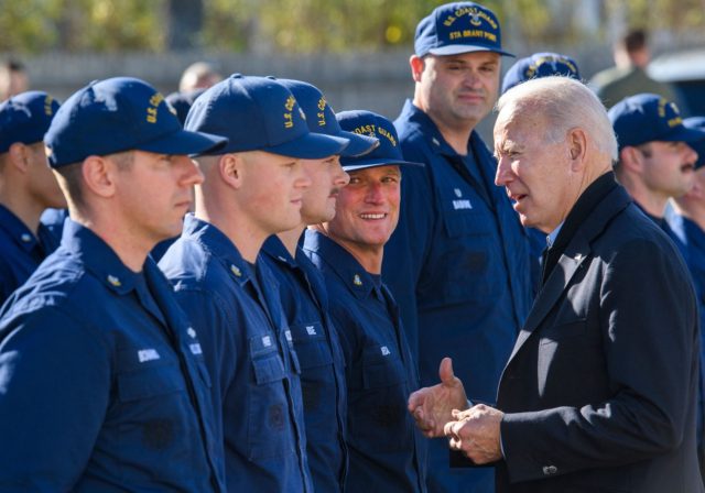 US President Joe Biden greets members of the Coast Guard at US Coast Guard Station Brant Point in Nantucket, Massachusetts on November 25, 2021. - Biden is in Nantucket to spend the Thanksgiving holiday.