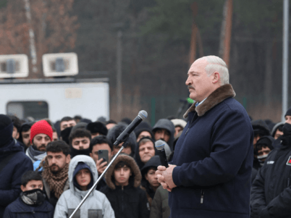 Belarus's President Alexander Lukashenko visits a centre for migrants that remain in the country after attempting to cross into the EU via the Polish border, near the Bruzgi border point on the Belarusian-Polish border in the Grodno region on November 26, 2021. - Belarus OUT (Photo by Maxim GUCHEK / …