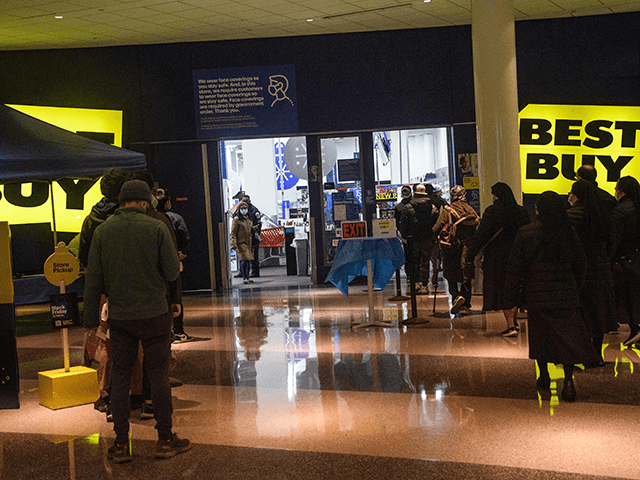 Black Friday shoppers leave a Best Buy store in Washington, DC, on November 26, 20221. - Known as Black Friday, the day after Thanksgiving marks the beginning of the holiday shopping season. (Photo by Nicholas Kamm / AFP) (Photo by NICHOLAS KAMM/AFP via Getty Images)