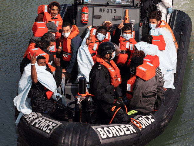 DOVER, ENGLAND - SEPTEMBER 22: Border Force officials unload migrants, that have been inte