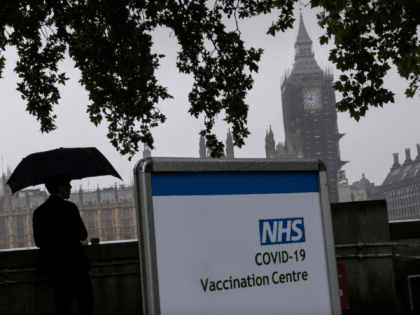 LONDON, UNITED KINGDOM - SEPTEMBER 13: A Covid-19 vaccination centre sign stands at St Thomas' hospital opposite Westminster on September 13, 2021 in London, United Kingdom. Tomorrow, British Prime Minister Boris Johnson will set out his plan to manage Covid-19 through the winter, including what actions would need to be …