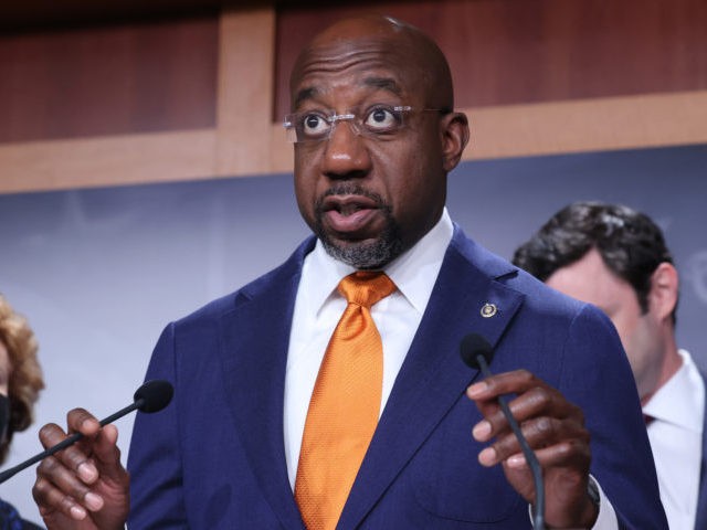 WASHINGTON, DC - SEPTEMBER 28: Sen. Raphael Warnock (D-GA) and other Democratic members of Congress hold a news conference to push for a solar tax credit at the U.S. Capitol on September 28, 2021 in Washington, DC. The House and Senate Democrats are pushing for a refundable tax credit for …