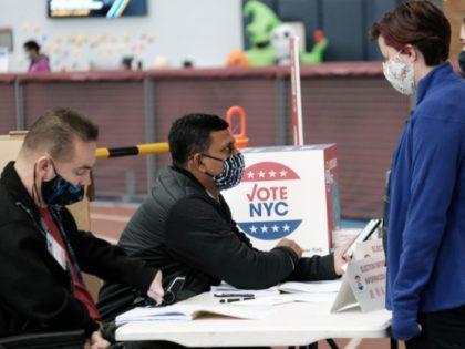 NEW YORK, NEW YORK - NOVEMBER 02: People visit a voting site at a YMCA on Election Day, November 02, 2021 in the Brooklyn borough of New York City. Over 30,000 New Yorkers have already cast their ballots in early voting for a series of races including the race for …