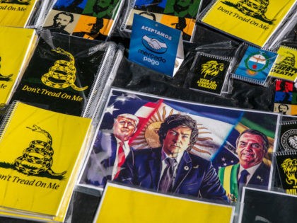 BUENOS AIRES, ARGENTINA - NOVEMBER 06: Posters with the images of Donald Trump (USA), Jair Bolsonaro (Brazil) and Javier Milei deputy candidate of La Libertad Avanza are displayed among the Political party merchandise offered to sell during an event to close the campaign at Parque Lezama on November 6, 2021 …