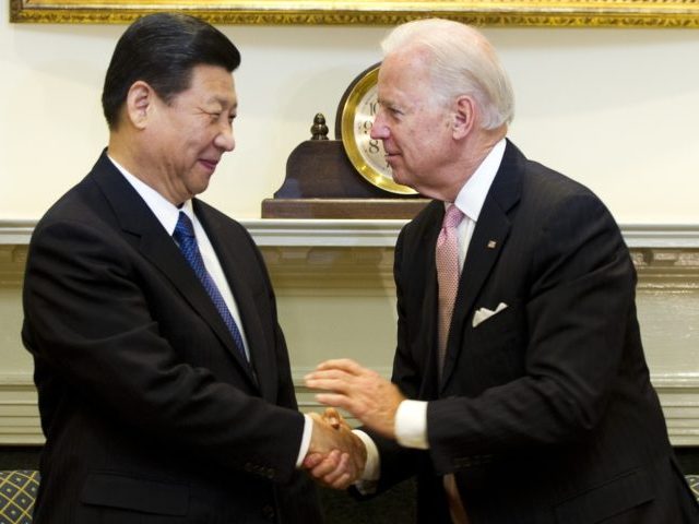 US Vice President Joe Biden (R) shakes hands with Chinese Vice President Xi Jinping in the